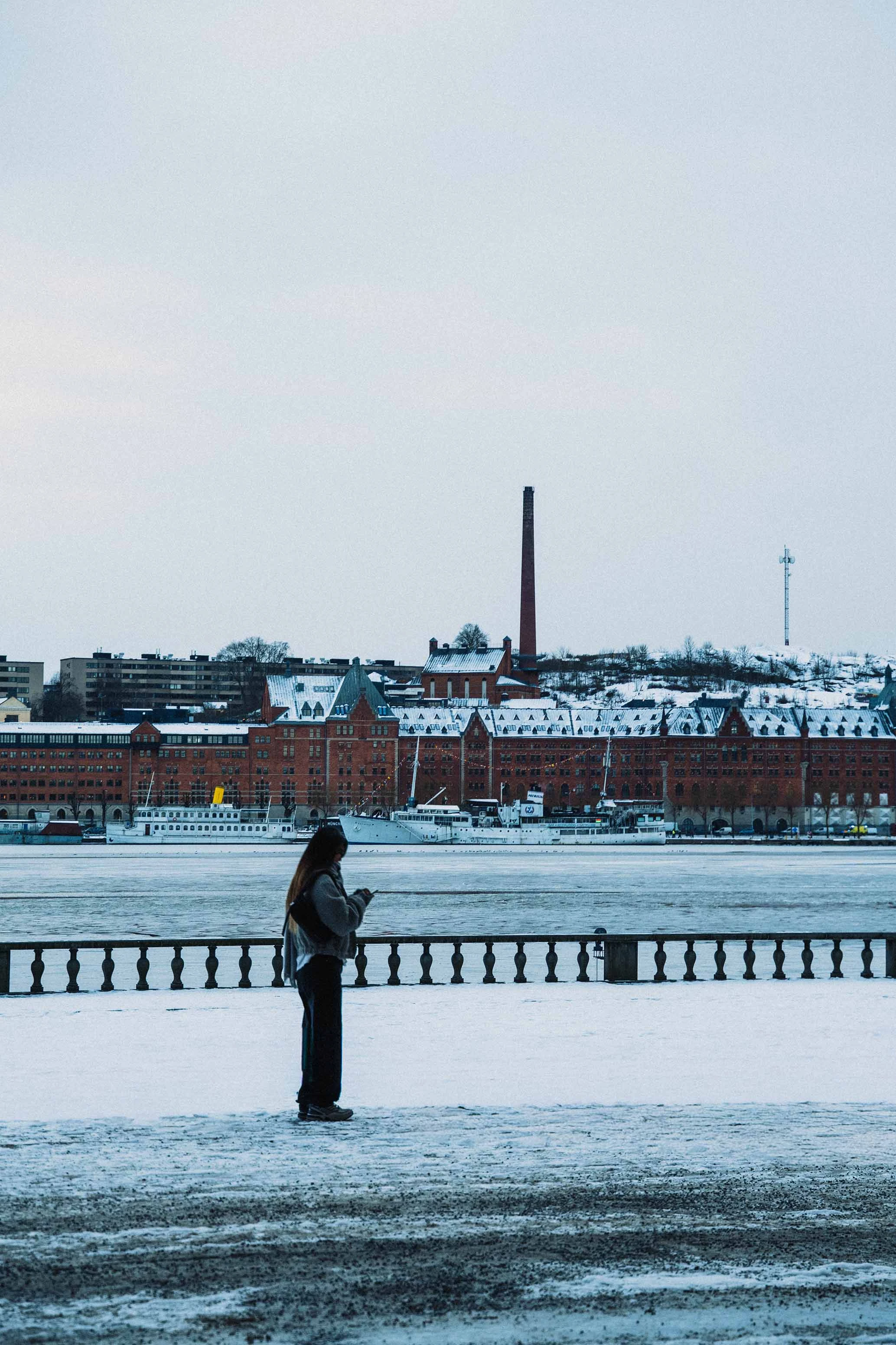 a girl standing in the snow